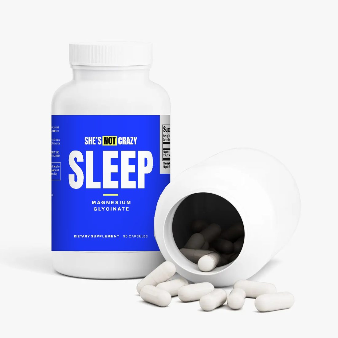 SLEEP bottle tipped over with white capsules spilling out